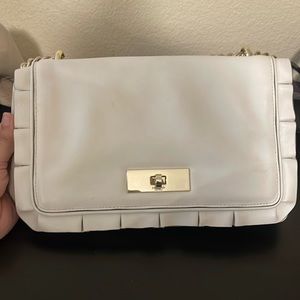 White Kate spade shoulder bag.